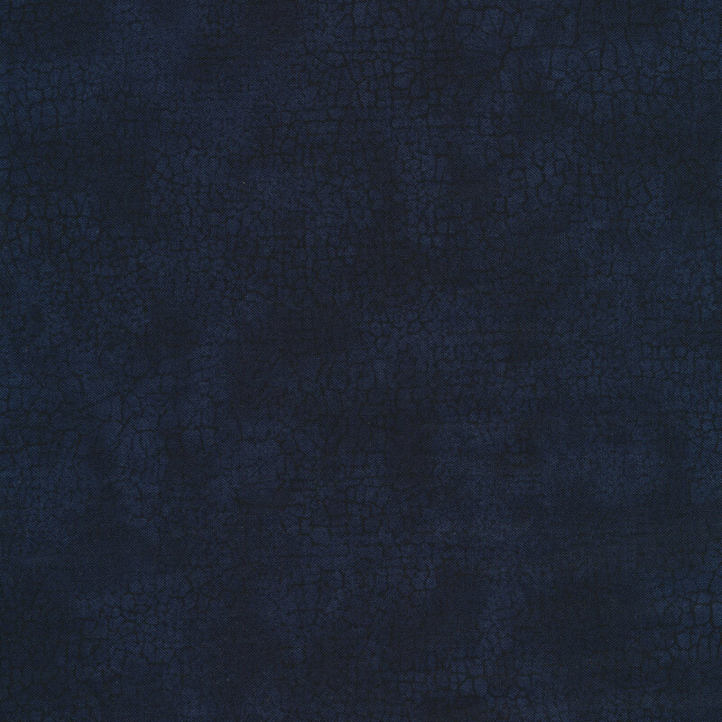 Mottled tonal dark blue fabric features crackle texture design