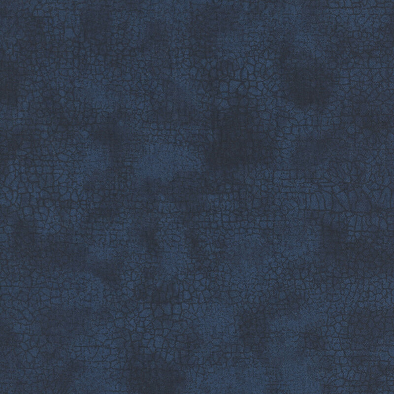 Mottled tonal dark blue fabric features crackle texture design
