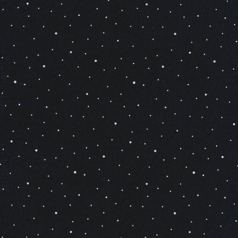 A starry night sky fabric filled with scattered white dots on a dark black background.