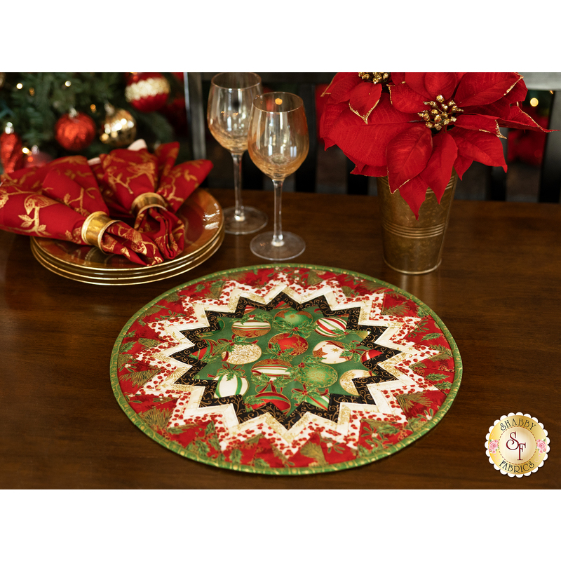 Folded star table topper with lovely Christmas prints in red, green, and white.