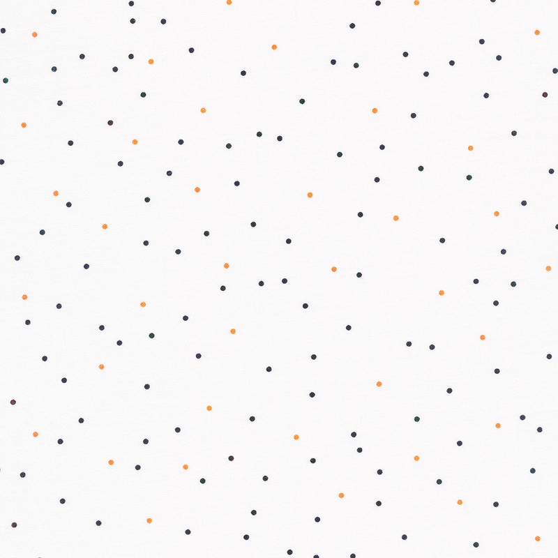 white fabric with scattered black and orange dots