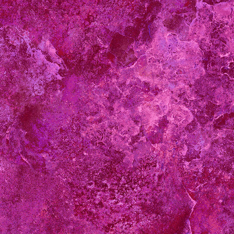 A marbled fuchsia colored fabric with mottling throughout