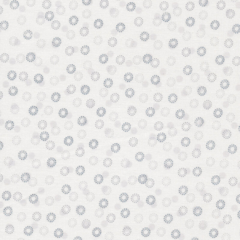 Silver metallic circular snowflakes all over a white background