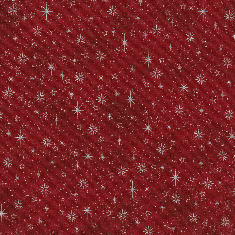 Bright red mottled fabric with silver metallic twinkling stars and snowflakes all over