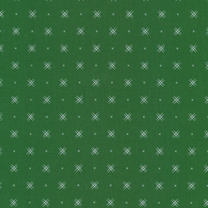 Forest green fabric with rows of small white x's and double criss-cross patterns