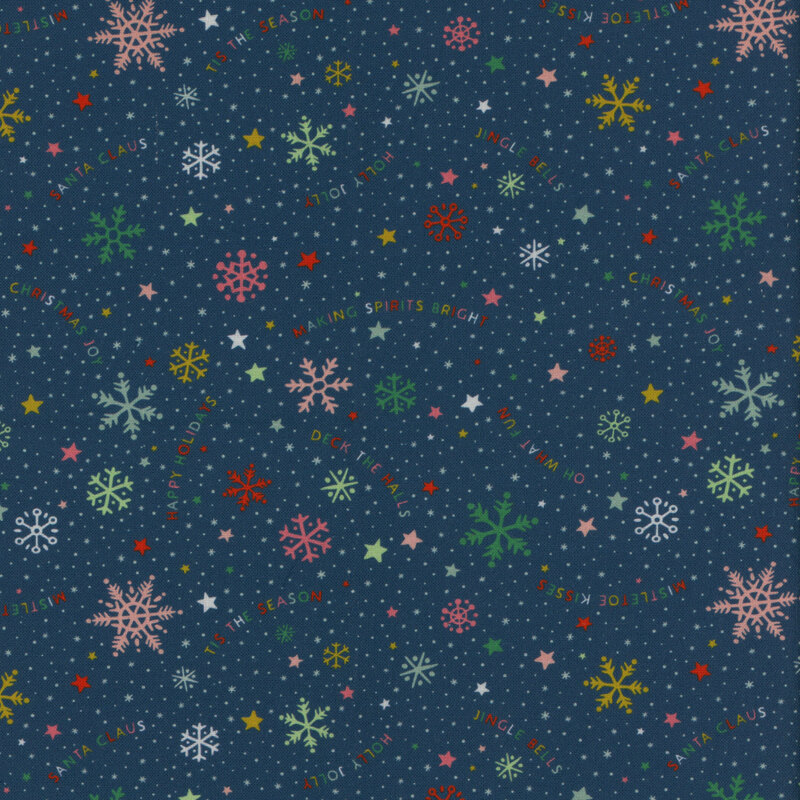 Navy blue fabric with multi-colored snowflakes and words tossed all over