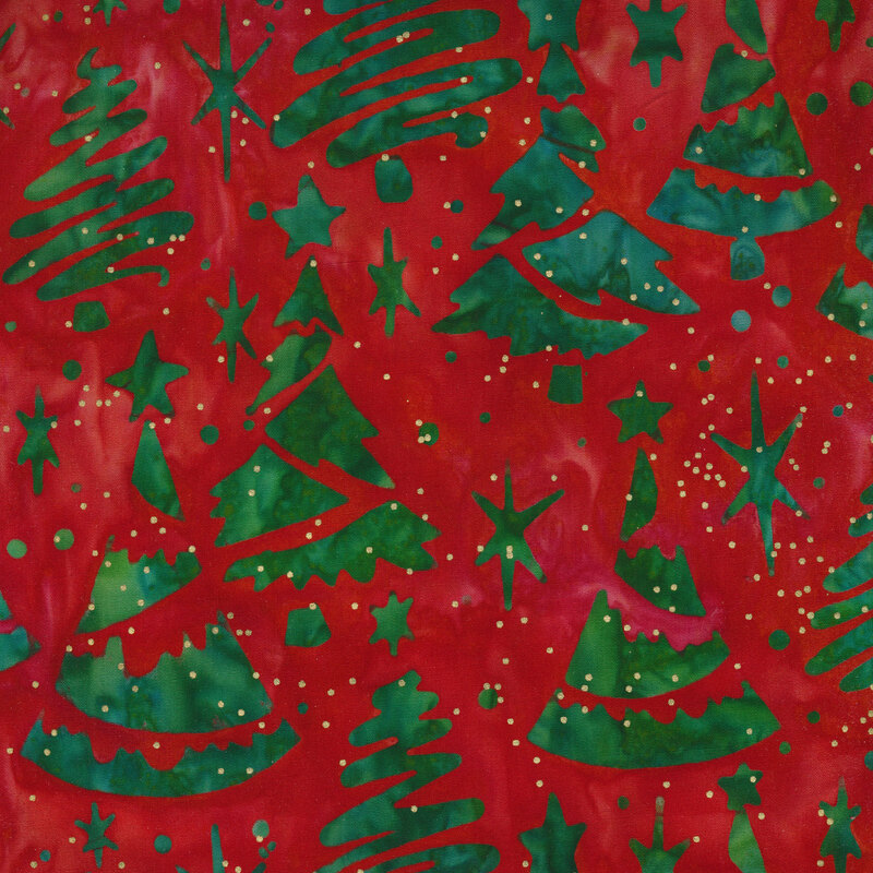 Dark red mottled batik fabric with dark green Christmas trees and stars