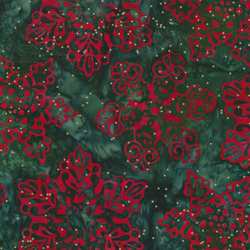 Dark green marbled batik fabric with bright red snowflakes and gold metallic dots all over