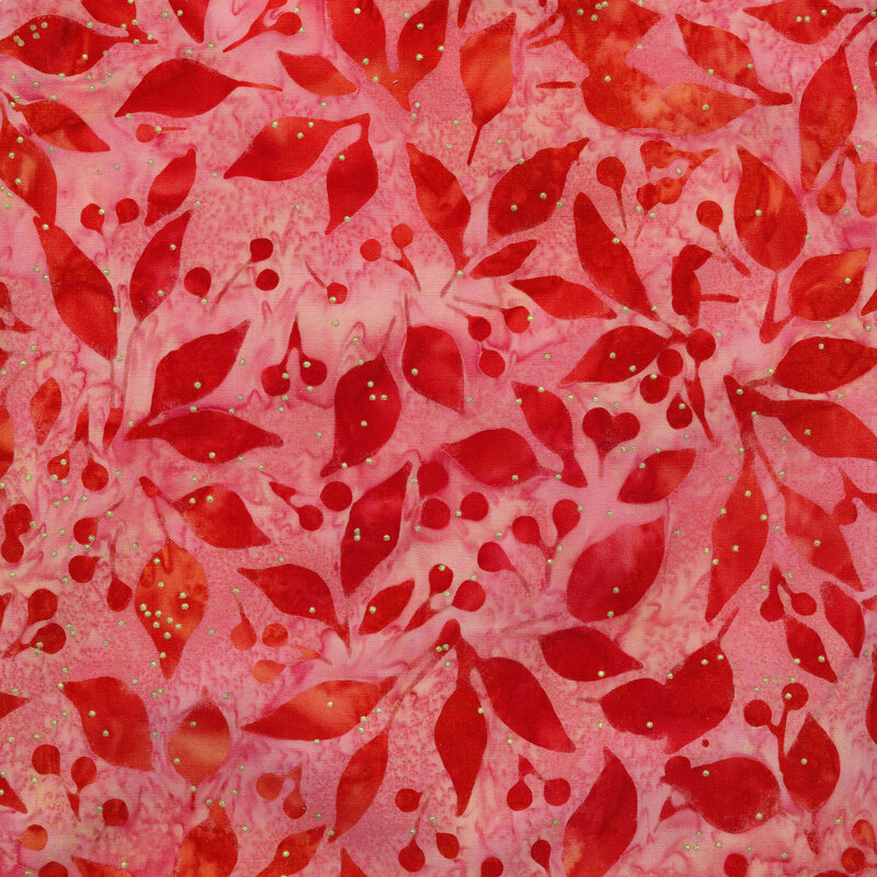 Reddish pink batik fabric with dark red leaves and berries all over