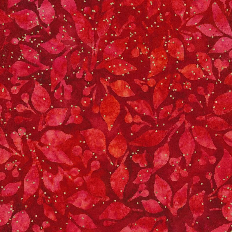 Dark red batik fabric with red leaves and berries and small gold metallic dots all over