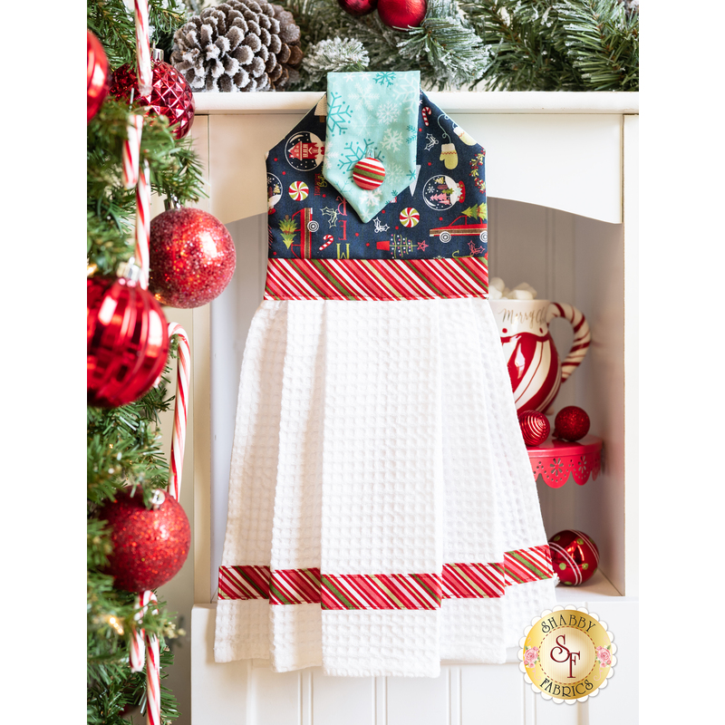 towel made of blue winter themed fabrics with candy cane striped accents.