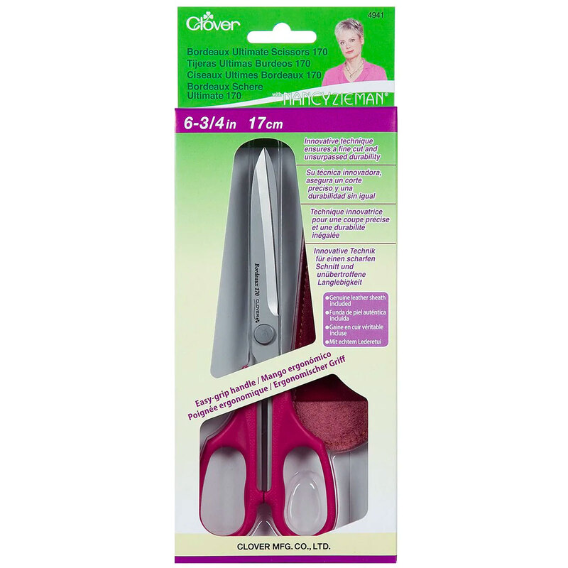 Packaging of Clover Ultimate Scissors, featuring a sleek design with pink handles and silver blades inside a green box.