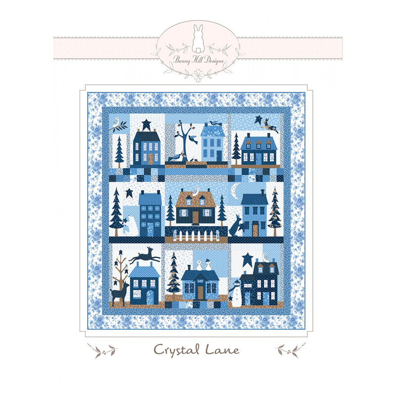 front of Crystal Lane Quilt kit showing a completed quilt with houses and winter scenes.