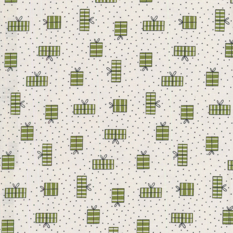 An off white Christmas fabric with green Christmas gifts and small black pin dots all over