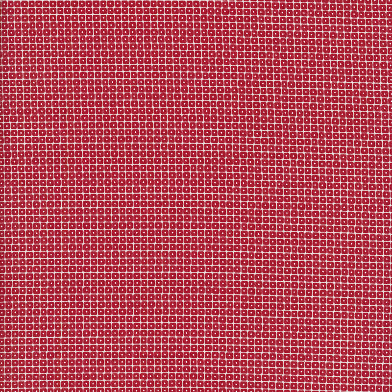 fabric featuring grids of small red squares with black spots in them