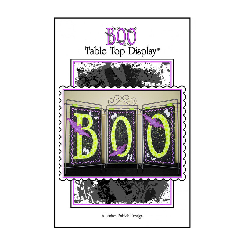 Front of BOO table top display pattern featuring the word boo with a black background and bat appliques