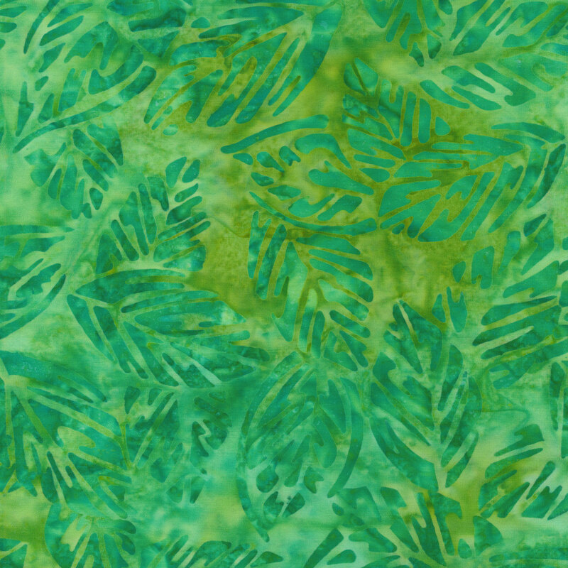 Fabric with kelly green leaves on a tonal green background