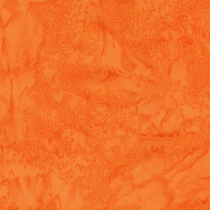 Mottled vibrant orange tonal batik fabric