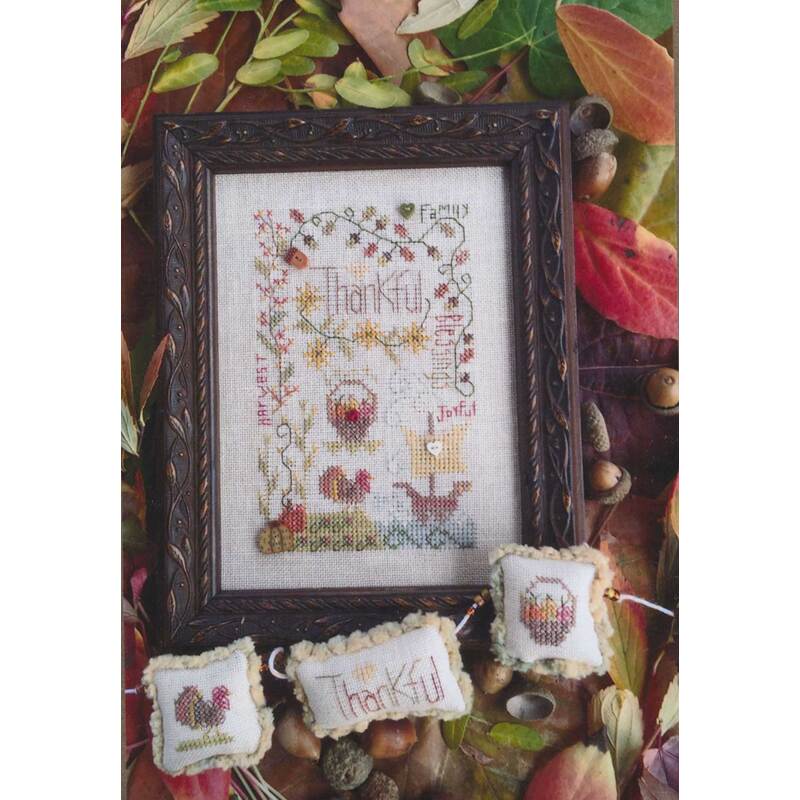 Picture of the thankful notes cross stitch pattern, showing the finished project with various thankful phrases and thanksgiving motifs