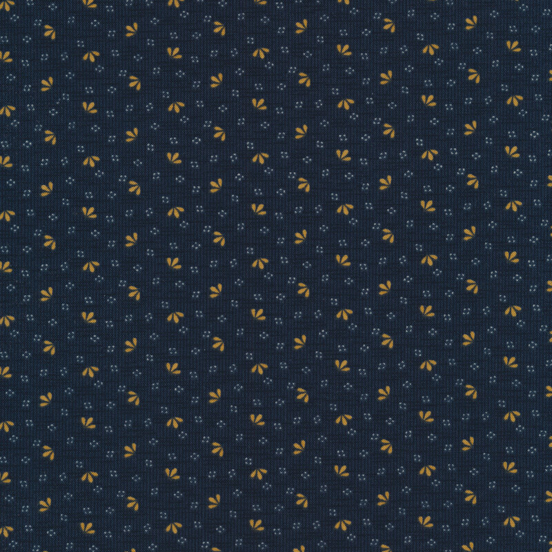 Fabric that features a woven dark navy blue fabric texture with gold motifs of small leaves. 