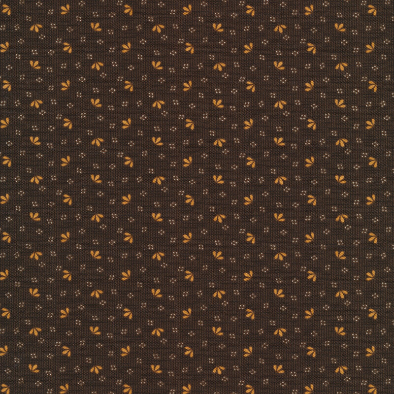 Fabric that features a woven dark brown fabric texture with gold leaf motifs