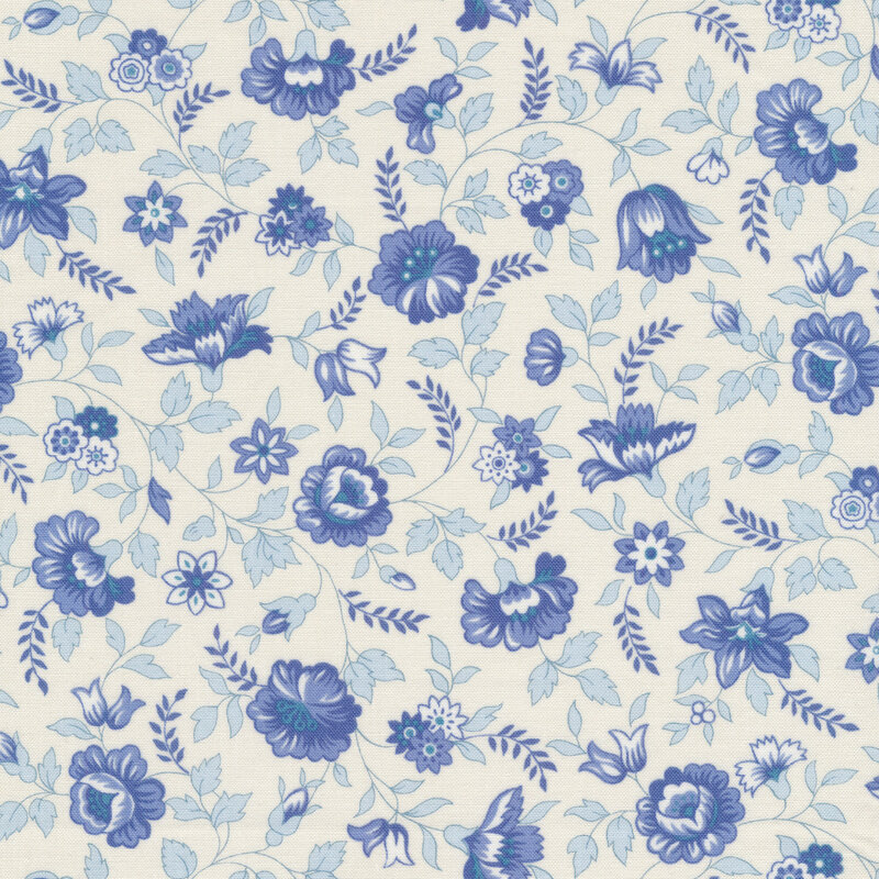 off white fabric features a variety of spring flowers from roses to daffodils and daisies in alternating shades of blue