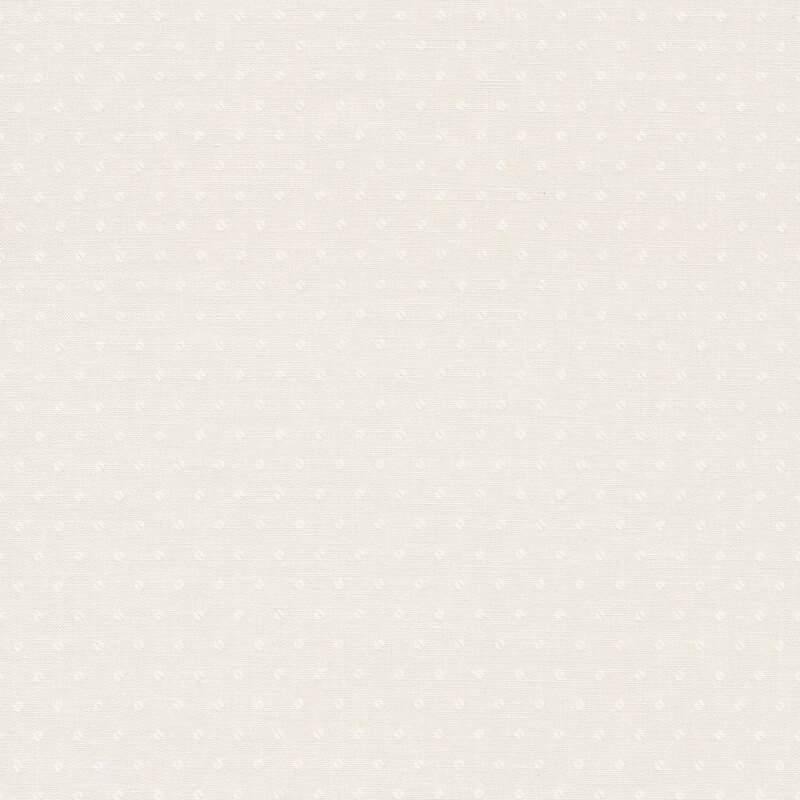 Cream fabric with small, white on white polka dots bisected into two half circles