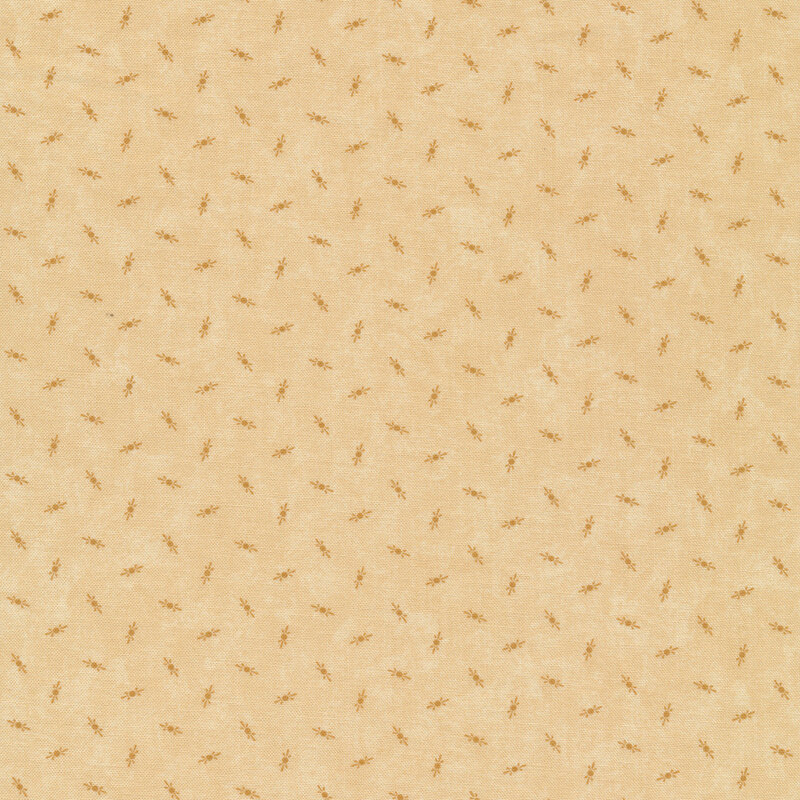 Fabric that features tossed cream motifs on a mottled creamy background.