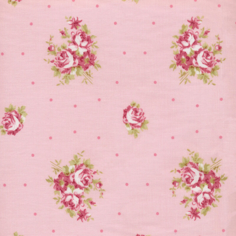 Image of fabric featuring arrangements of pink flowers and roses, interspersed with darker pink dots, on a lighter pink background