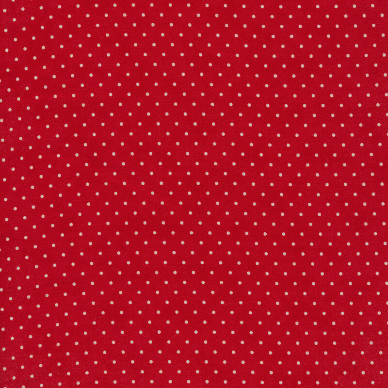 Lipstick red fabric with small white polka dots throughout