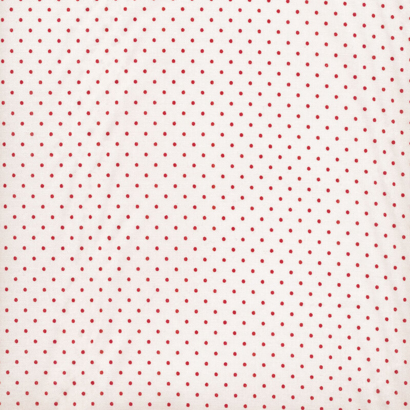 white fabric with small red polka dots throughout