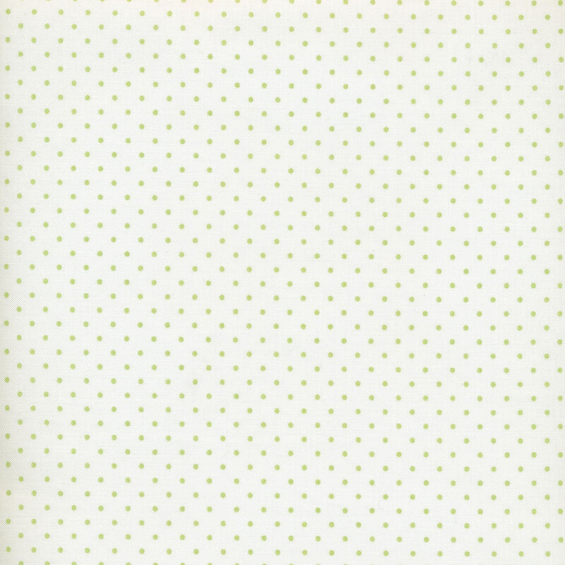 white fabric with light green polka dots