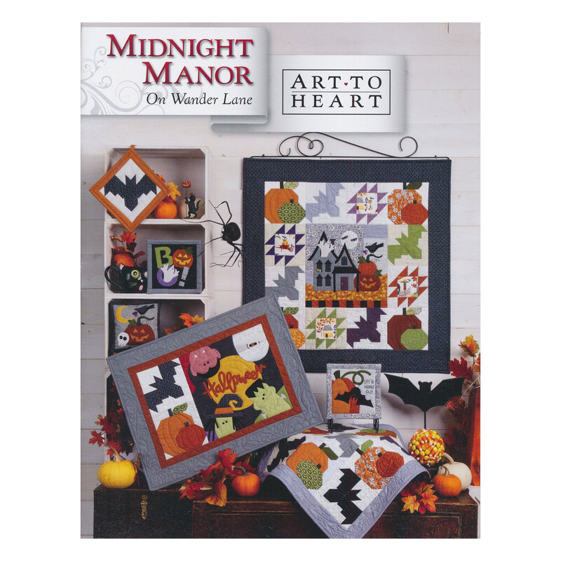 Scan of the front of the Midnight Manor block pattern book, showing the finished quilt and additional finished projects