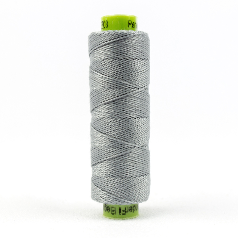 A spool of WonderFil Eleganza #8 EZ03 Tumbled Stone thread on a white background