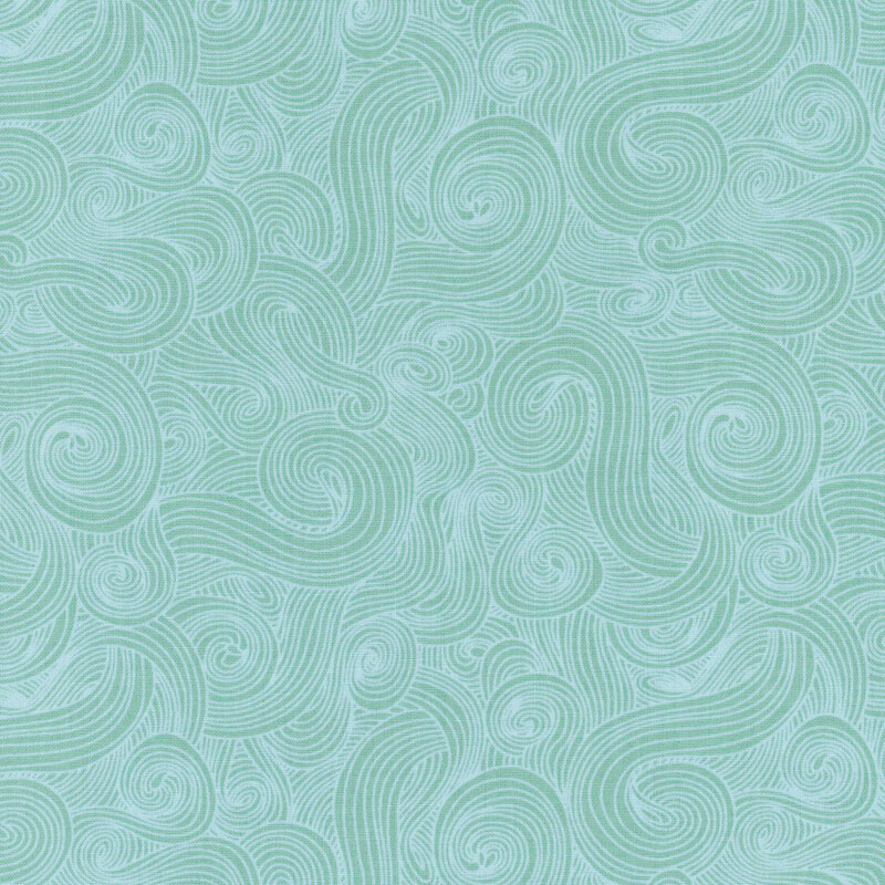 Tonal teal fabric with light swirls on a dark background