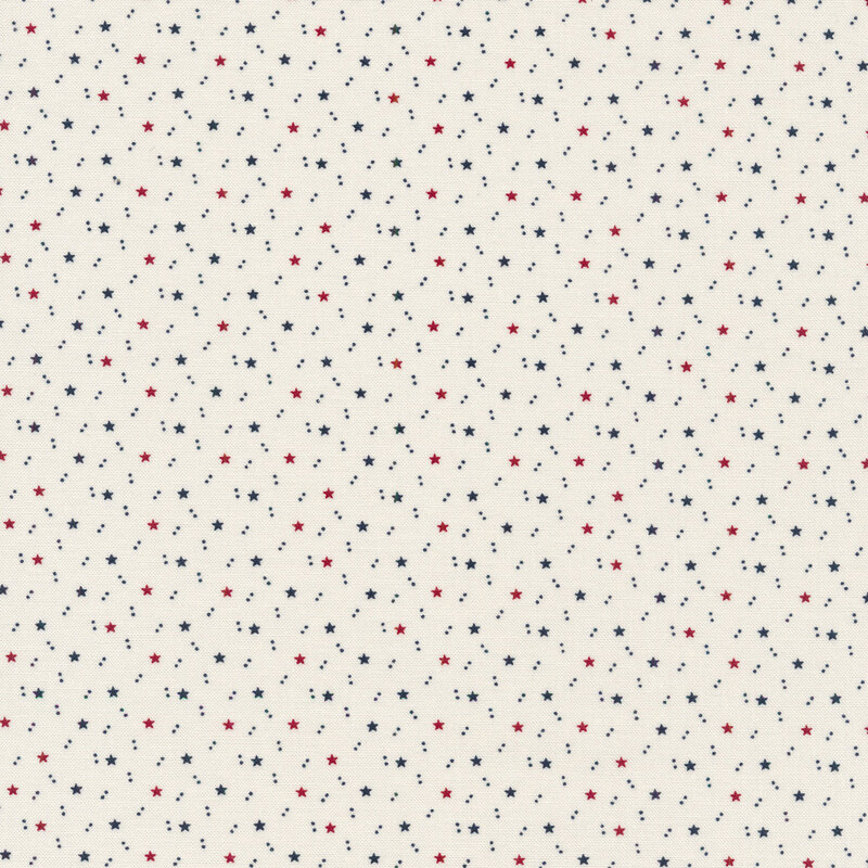 white patriotic fabric featuring red and blue accents of tiny stars and pairs of dots tossed all over