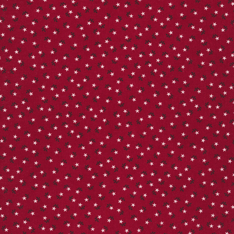 Red fabric swatch with tiny, ditsy, white stars paired with navy blue leaf sprigs