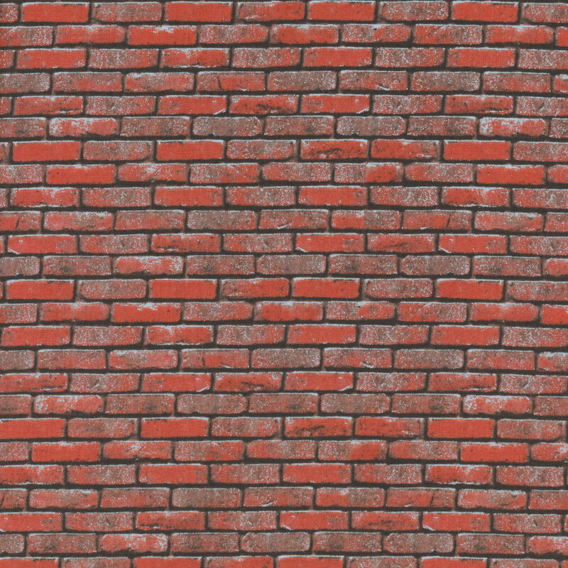 Fabric with a red and brown brick wall on it