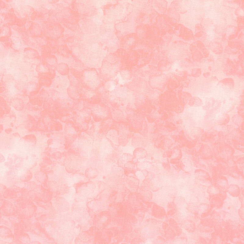 fabric with a baby pink color and mottled watercolor markings