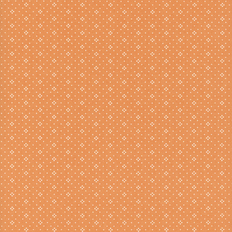 Orange fabric with small white dots all over