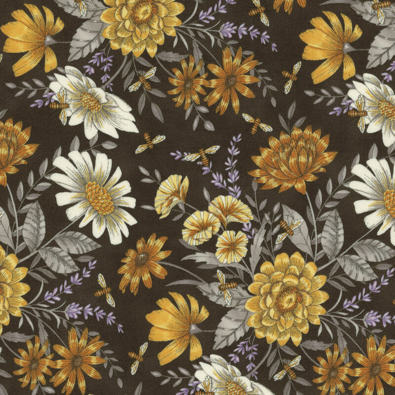 fabric with an array of ornate yellow florals and light gray leaves tossed on a dark gray background