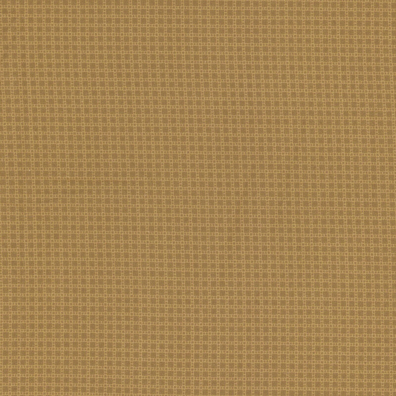 fabric featuring ditsy tan squares and dots on a light brown background