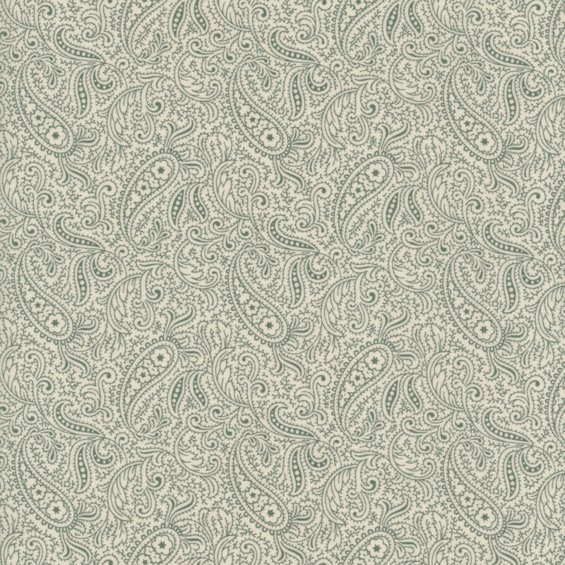 Scan of cream fabric with a light paisley pattern