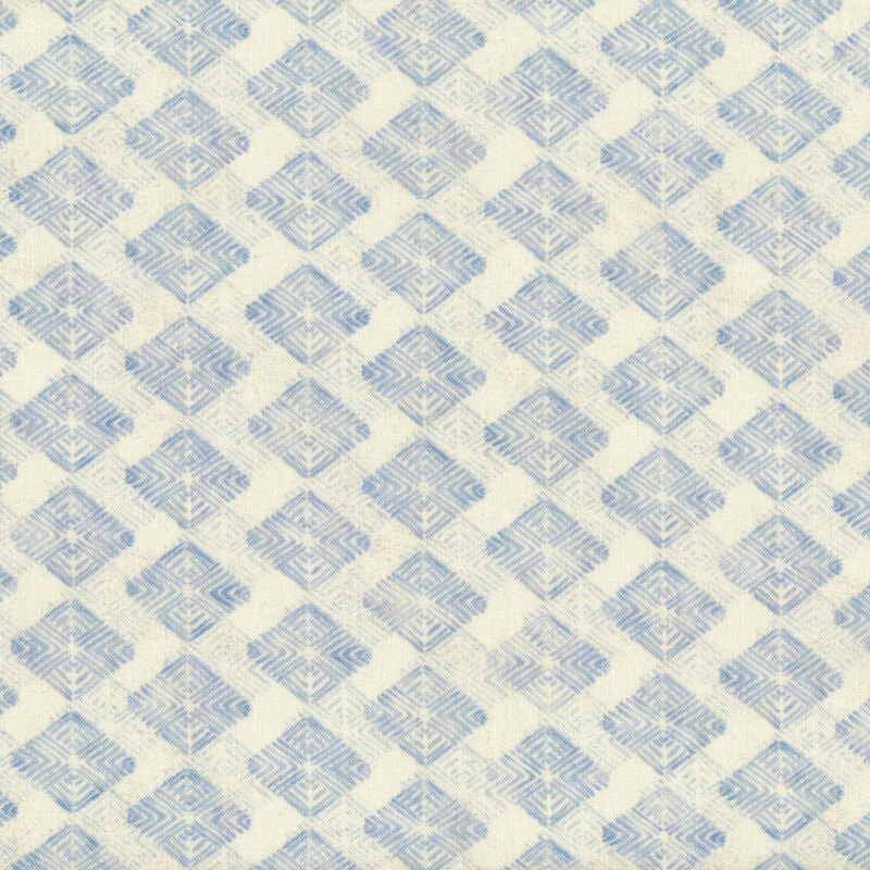 Light cream fabric with blue mottled diamonds throughout