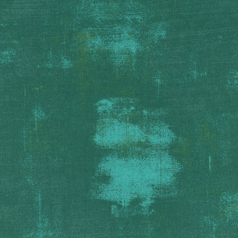 fabric featuring tonal teal and aqua grunge print