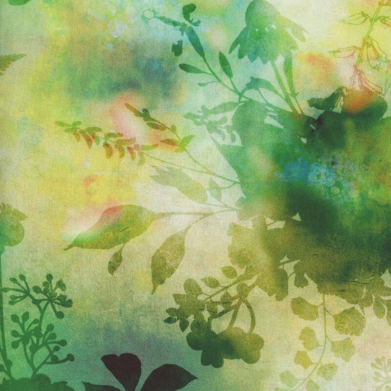 fabric featuring dark green flower and foliage silhouettes on a mottled green and yellow background.