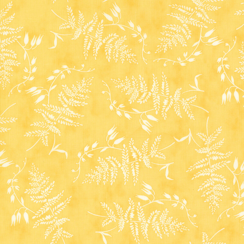 pastel yellow fabric featuring strewn white ferns and foliage