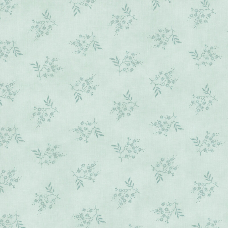 tonal pastel blue fabric featuring scattered deeper light blue flowers