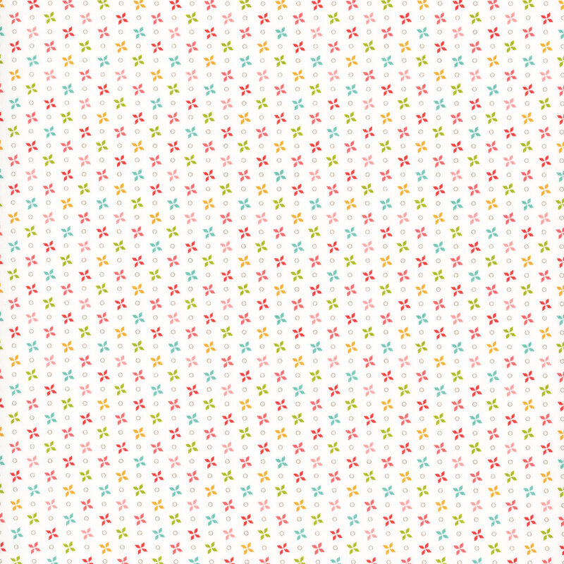 fabric featuring multicolor pinwheel print on a solid cream white background.