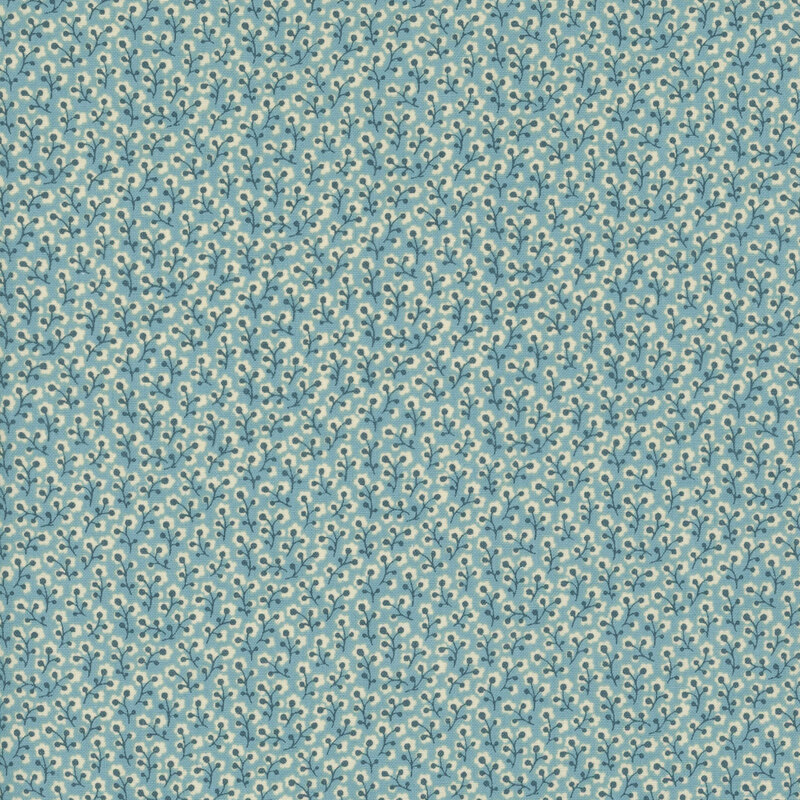 fabric featuring cream and dark blue flower vines on a light blue background.